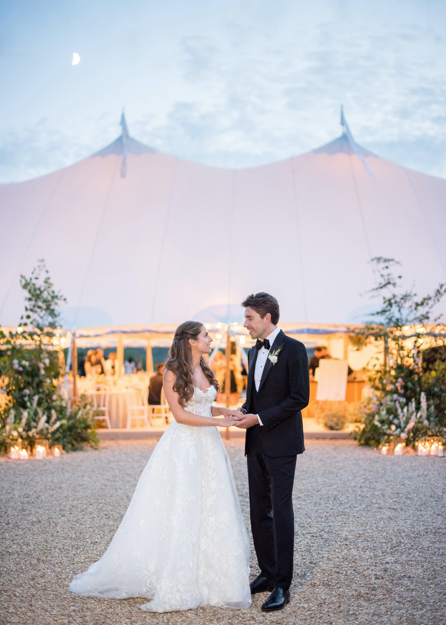 Newly weds Ellie and Sam in front of their Sperry Tent, designed by Katrina Otter Weddings with The Sail Tent Company.