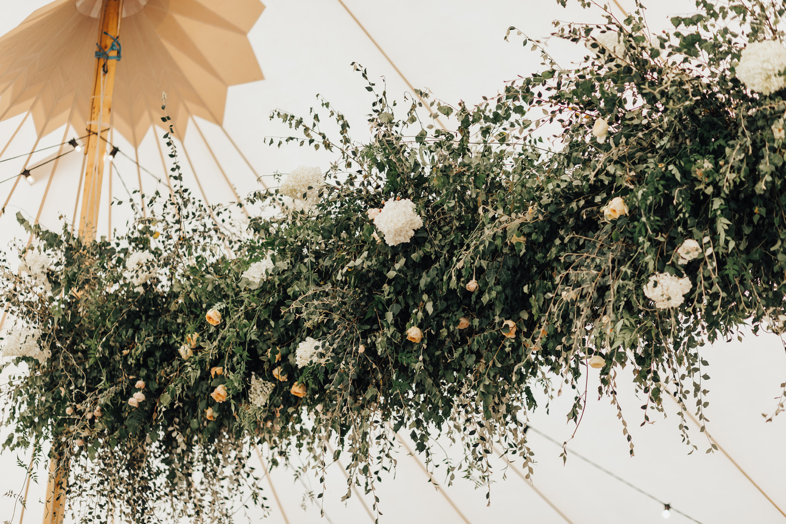 Lora & Dave's Garden Sperry Tent Wedding floral beam, by Natalie Hewitt & Joseph Benjamin Marquees Images by Rebecca Carpenter Photography